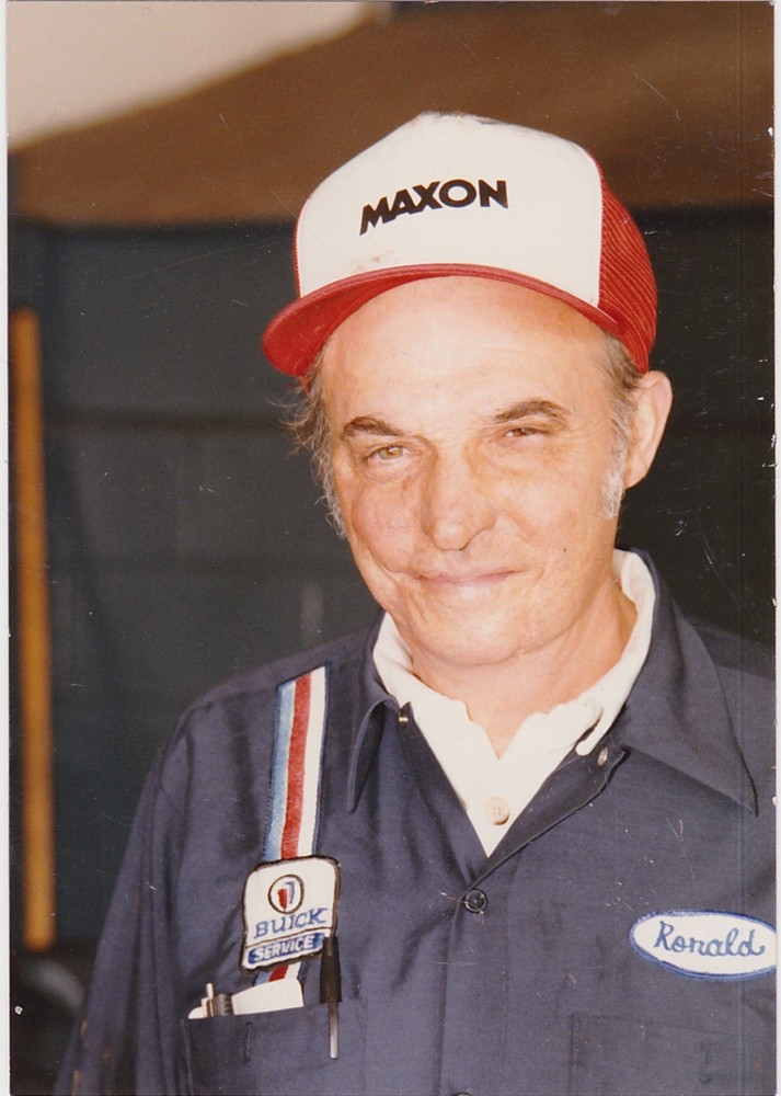 Photo of Ronald Cherry in shop with red cap